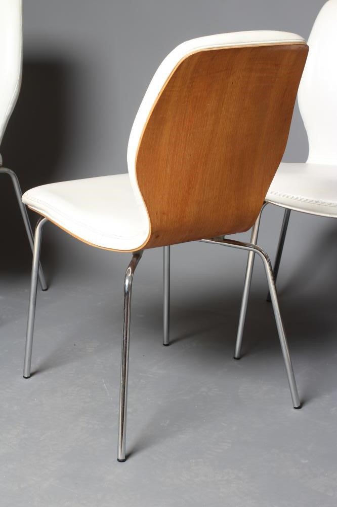 A SET OF SIX MOULDED TEAK VENEERED DINING CHAIRS Image