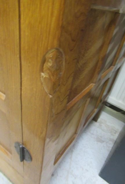 A ROBERT THOMPSON ADZED OAK WARDROBE of oblong multi panelled form with half penny moulded cornice Image