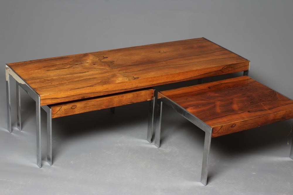 A NEST OF ROSEWOOD COFFEE TABLES Image