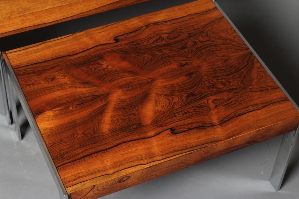 A NEST OF ROSEWOOD COFFEE TABLES Image