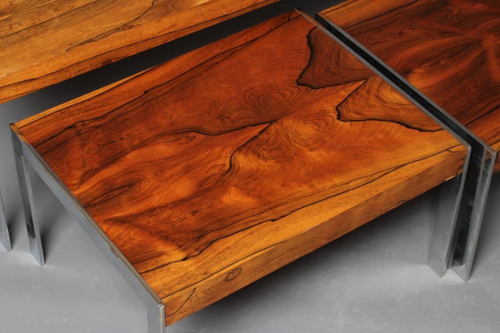 A NEST OF ROSEWOOD COFFEE TABLES Image