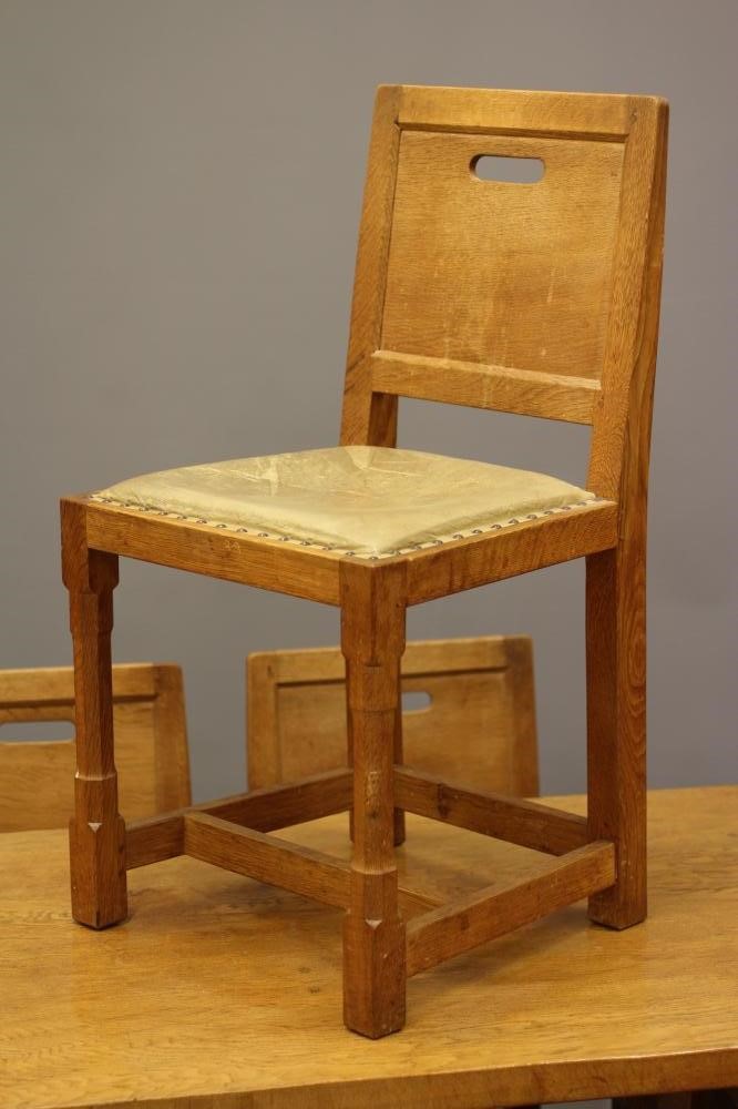 A PETER HEAP OAK DINING TABLE AND SIX CHAIRS Image