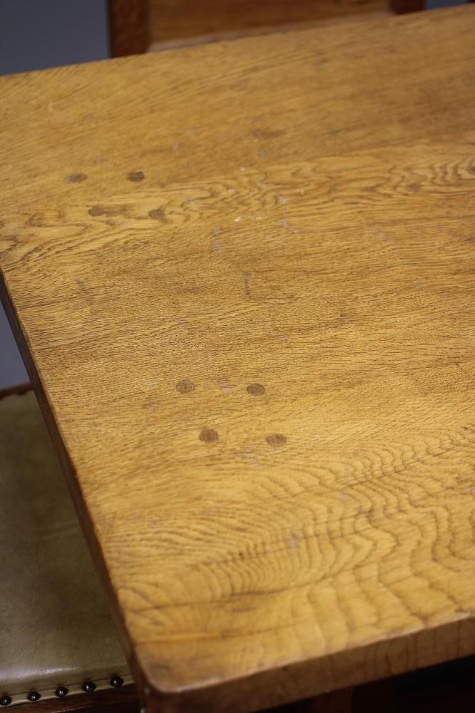 A PETER HEAP OAK DINING TABLE AND SIX CHAIRS Image