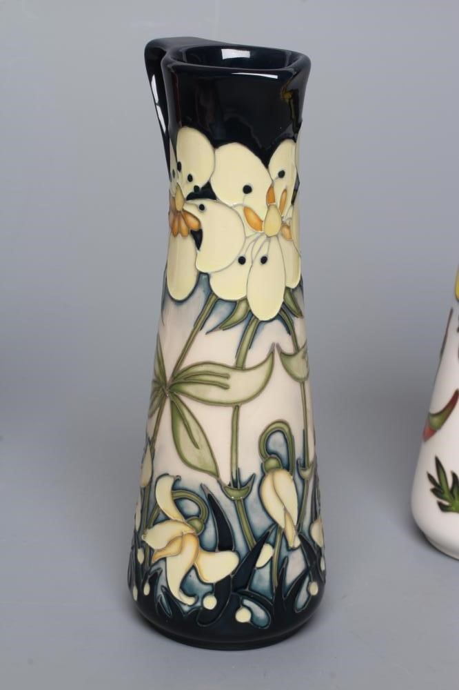THREE MOORCROFT POTTERY EWERS of tapering cylindrical form Image
