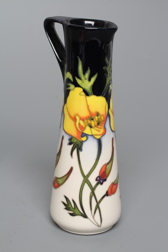 THREE MOORCROFT POTTERY EWERS of tapering cylindrical form Image