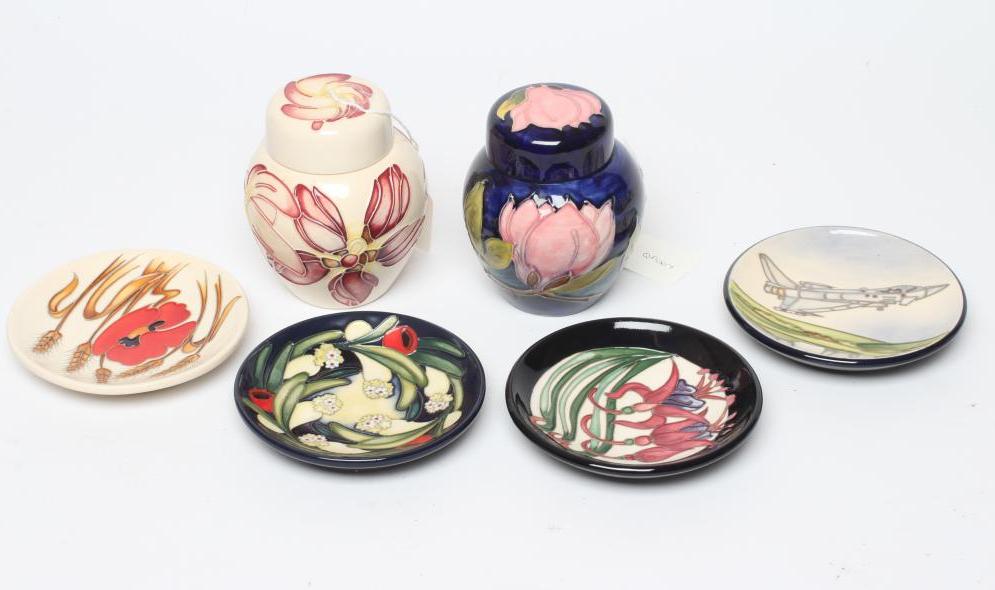 FOUR MOORCROFT POTTERY PIN TRAYS of circular form Image