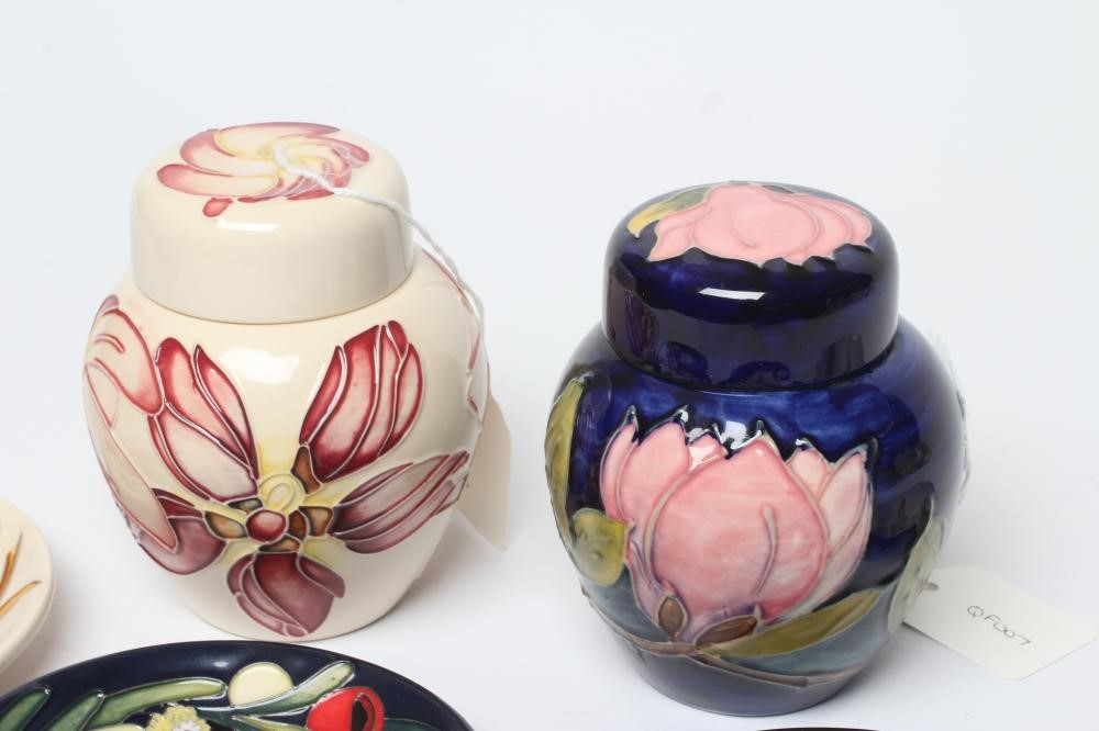 FOUR MOORCROFT POTTERY PIN TRAYS of circular form Image