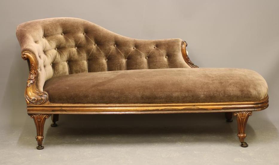 A VICTORIAN WALNUT FRAMED CHAISE LONGUE Image