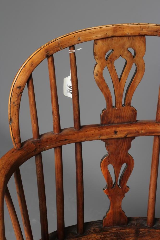 A YEW AND ELM WINDSOR ARMCHAIR Image