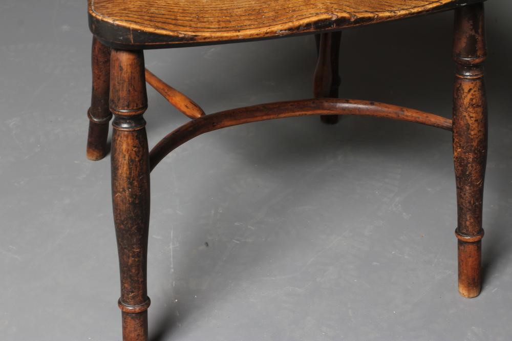 A YEW AND ELM WINDSOR ARMCHAIR Image