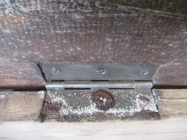 AN INDIAN CARVED WOOD CHEST of oblong form with panels of birds amongst foliate scrolls and with Image