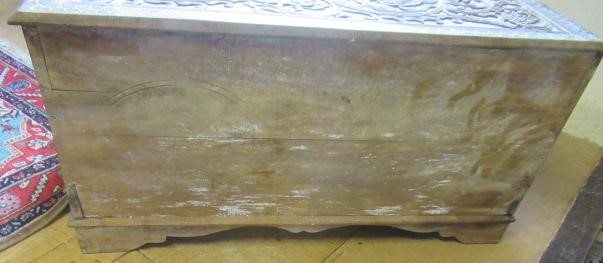 AN INDIAN CARVED WOOD CHEST of oblong form with panels of birds amongst foliate scrolls and with Image