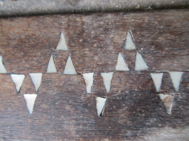AN INDIAN CARVED WOOD CHEST of oblong form with panels of birds amongst foliate scrolls and with Image