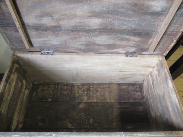 AN INDIAN CARVED WOOD CHEST of oblong form with panels of birds amongst foliate scrolls and with Image