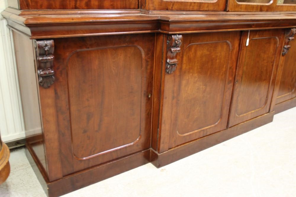 A VICTORIAN MAHOGANY BREAKFRONT LIBRARY BOOKCASE Image