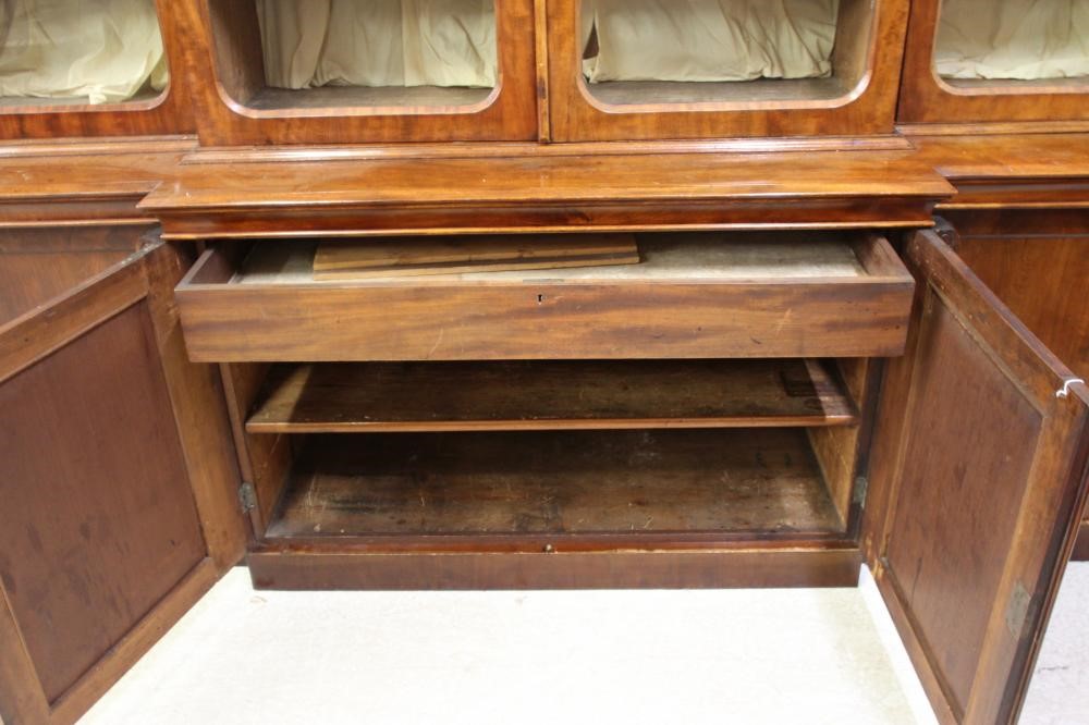 A VICTORIAN MAHOGANY BREAKFRONT LIBRARY BOOKCASE Image