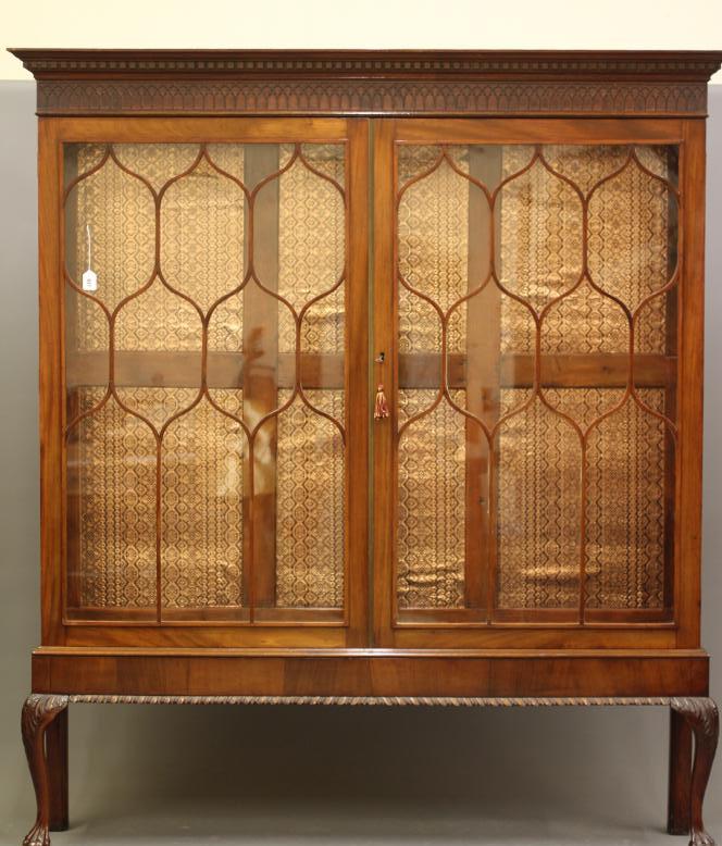 A MAHOGANY DISPLAY CABINET Image