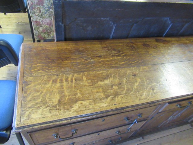 A GEORGIAN OAK AND MAHOGANY BANDED ENCLOSED DRESSER Image