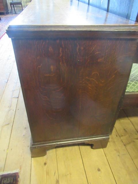 A GEORGIAN OAK AND MAHOGANY BANDED ENCLOSED DRESSER Image