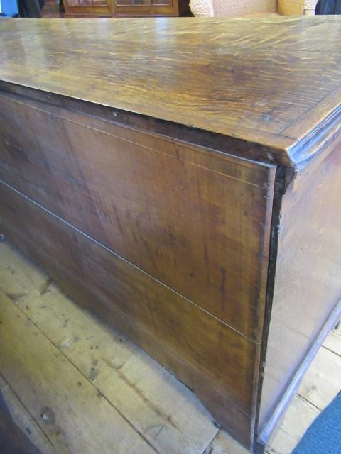 A GEORGIAN OAK AND MAHOGANY BANDED ENCLOSED DRESSER Image
