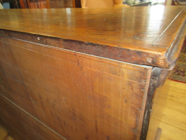 A GEORGIAN OAK AND MAHOGANY BANDED ENCLOSED DRESSER Image