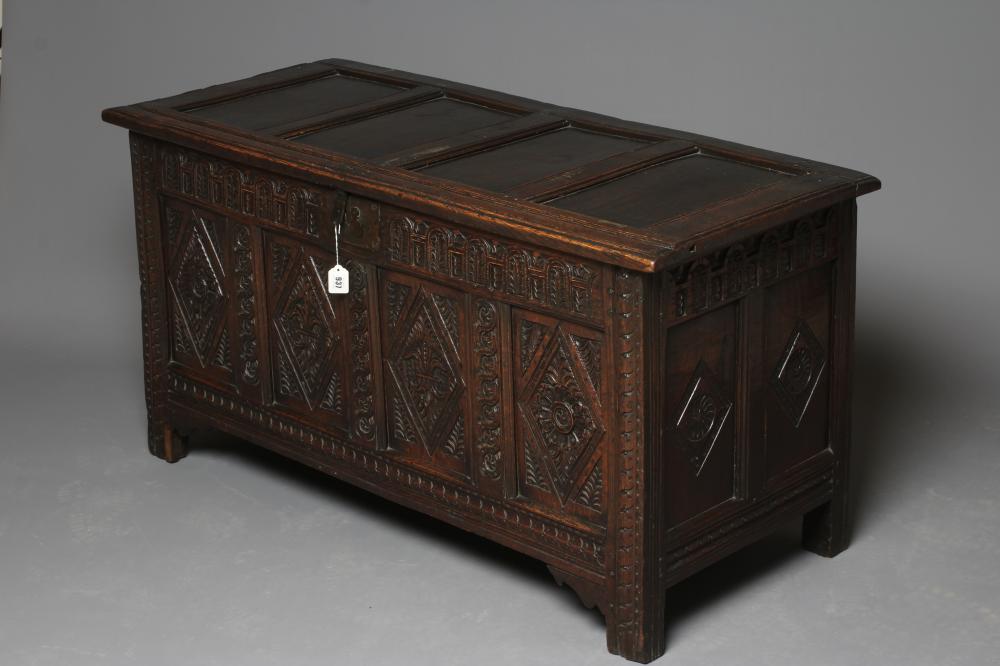 AN OAK PANELLED COFFER Image