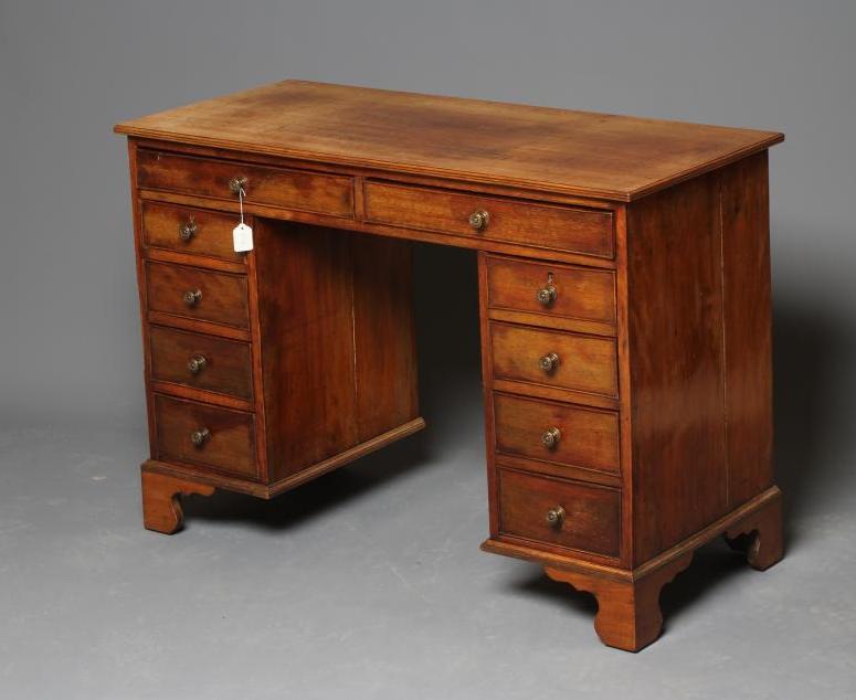 A MAHOGANY KNEEHOLE DESK Image