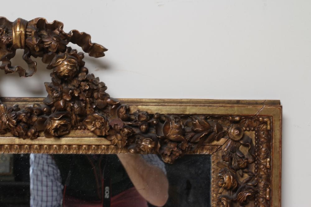 A CARVED GILT WOOD PIER GLASS Image