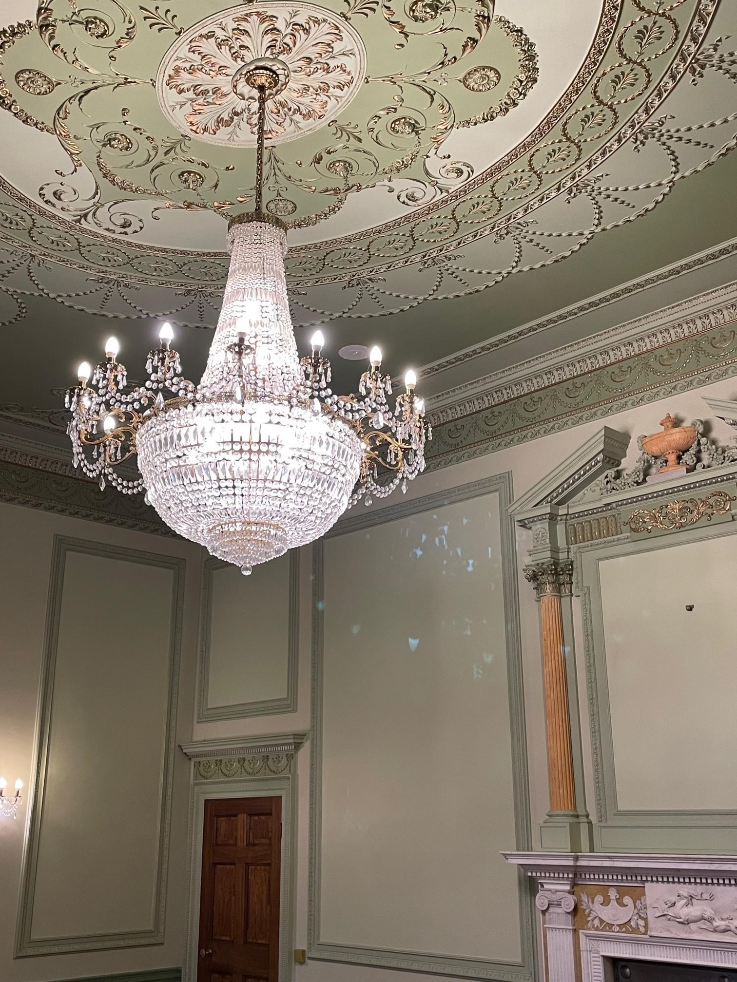 A GILT METAL AND CUT GLASS TWENTY FLAME CHANDELIER Image