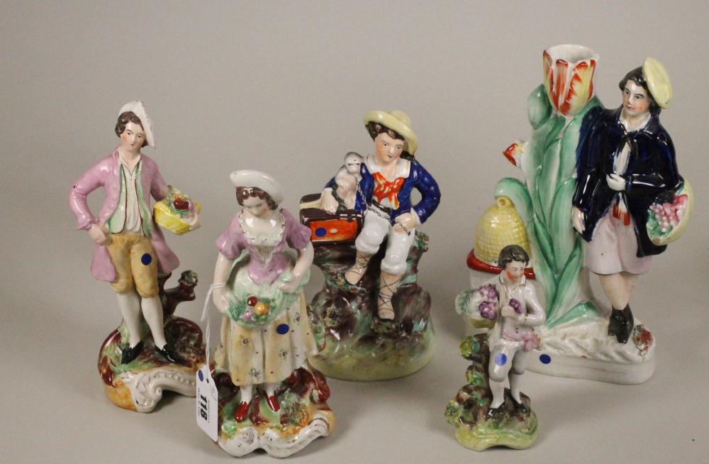 A VICTORIAN STAFFORDSHIRE POTTERY FIGURE of a young boy seated with his arm around a monkey on a Image