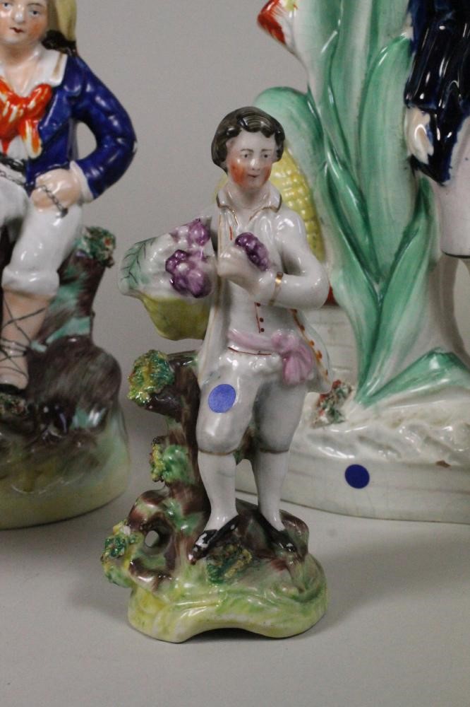 A VICTORIAN STAFFORDSHIRE POTTERY FIGURE of a young boy seated with his arm around a monkey on a Image