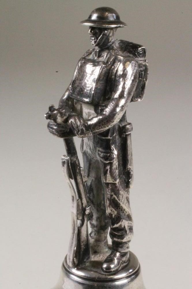 A SILVER MODEL OF A SOLDIER Image