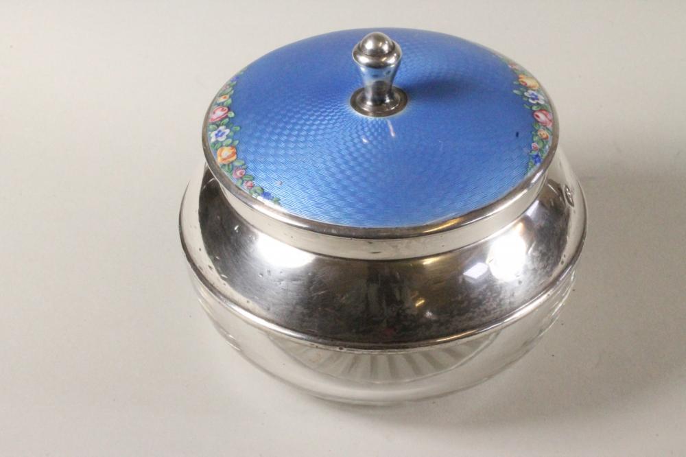 AN ART DECO GLASS AND SILVER DRESSING TABLE BOX of squat globular form with star cut base and plain Image