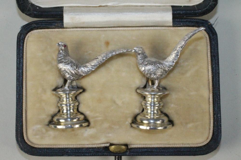 A PAIR OF NOVELTY SILVER PLACE CARD HOLDERS Image