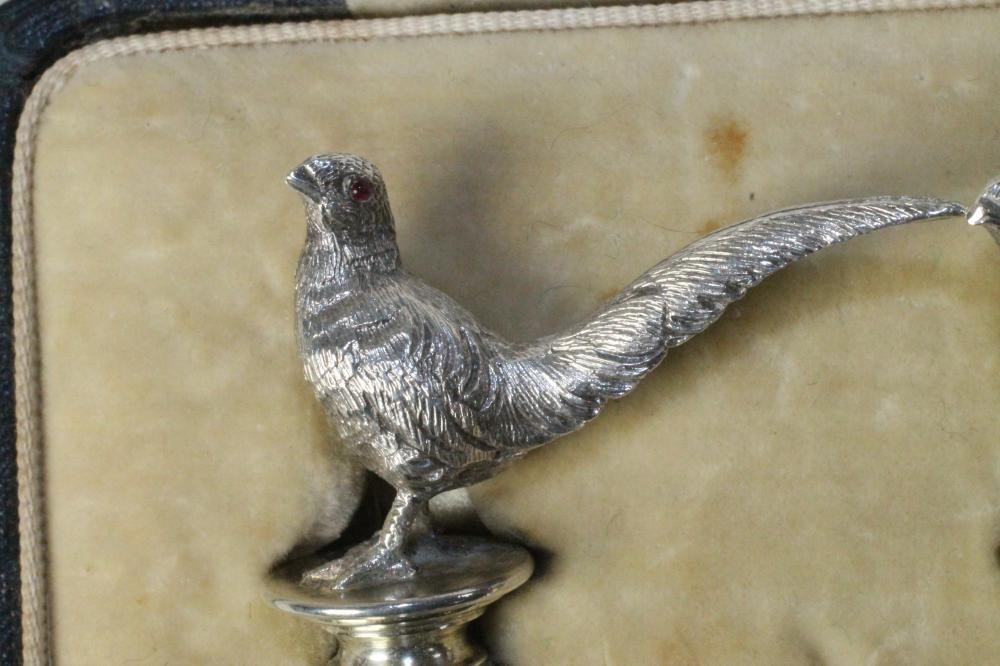 A PAIR OF NOVELTY SILVER PLACE CARD HOLDERS Image