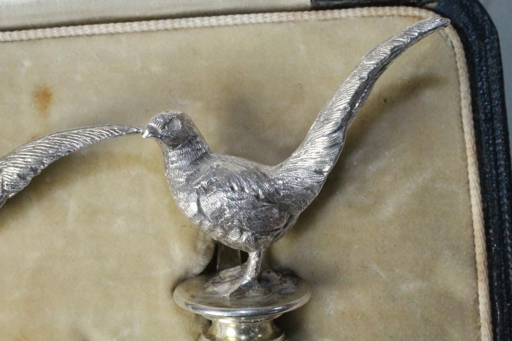 A PAIR OF NOVELTY SILVER PLACE CARD HOLDERS Image