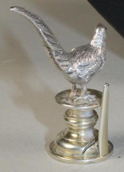 A PAIR OF NOVELTY SILVER PLACE CARD HOLDERS Image