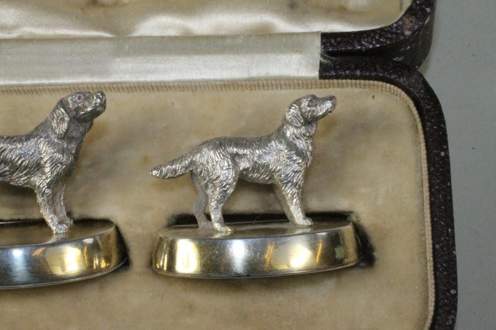 A SET OF FOUR NOVELTY SILVER PLACE CARD HOLDERS Image