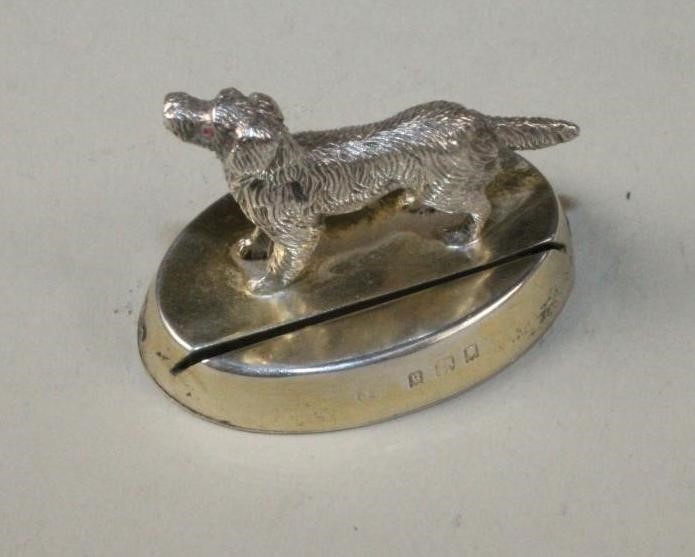 A SET OF FOUR NOVELTY SILVER PLACE CARD HOLDERS Image