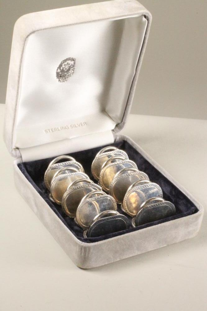 A SET OF TEN MODERN SILVER PLACE CARD HOLDERS Image