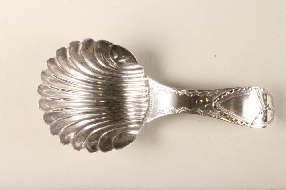 A LATE GEORGE III SILVER CADDY SPOON Image