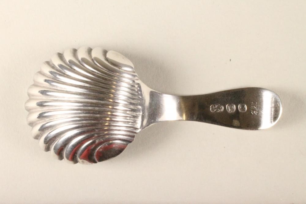 A LATE GEORGE III SILVER CADDY SPOON Image