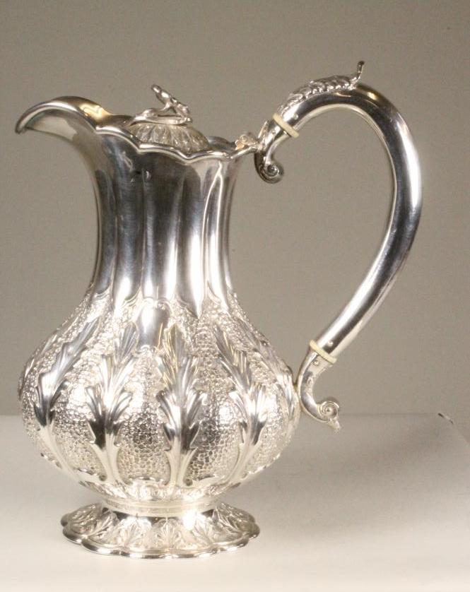 A SILVER HOT WATER JUG Image