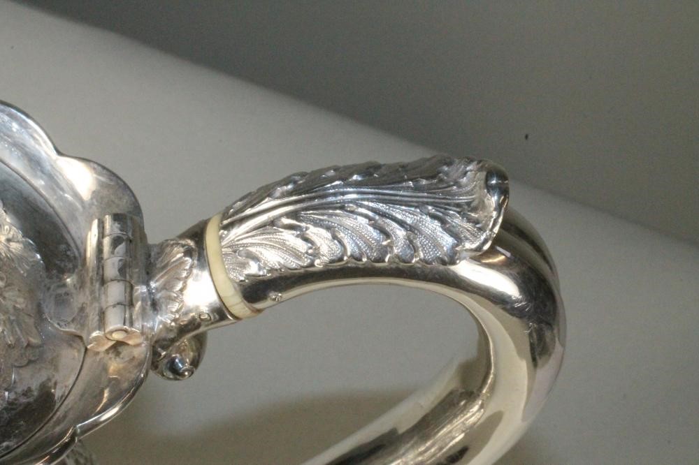 A SILVER HOT WATER JUG Image