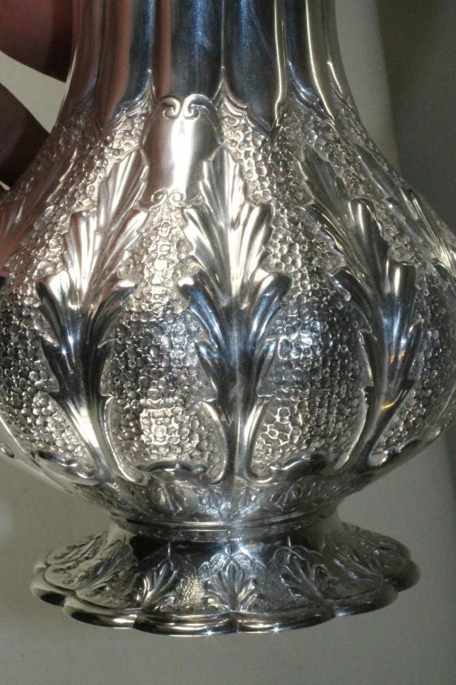 A SILVER HOT WATER JUG Image