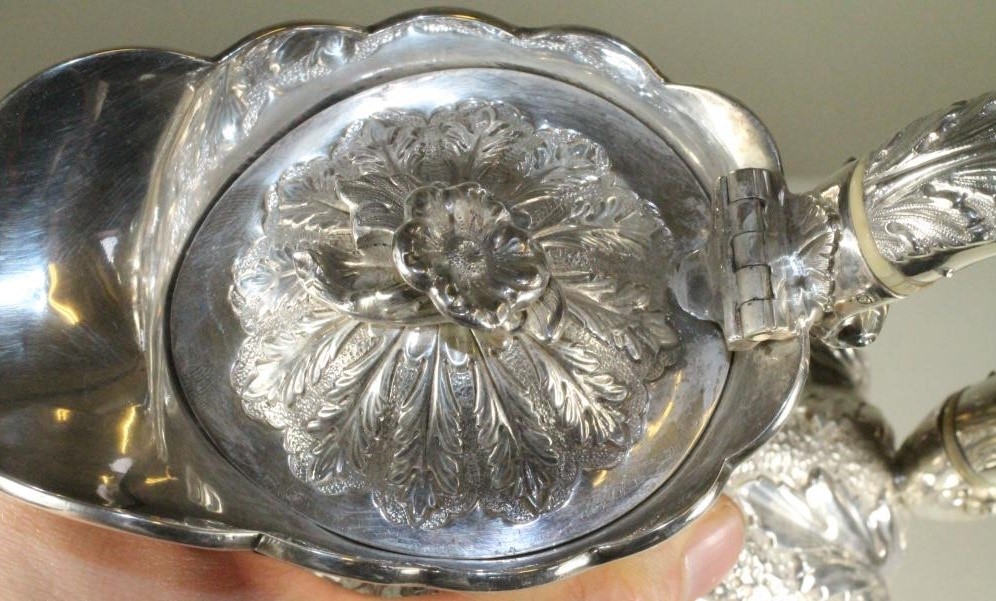 A SILVER HOT WATER JUG Image