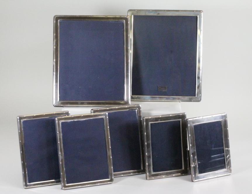 A SET OF SEVEN SILVER PHOTOGRAPH FRAMES Image