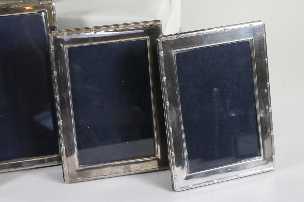 A SET OF SEVEN SILVER PHOTOGRAPH FRAMES Image