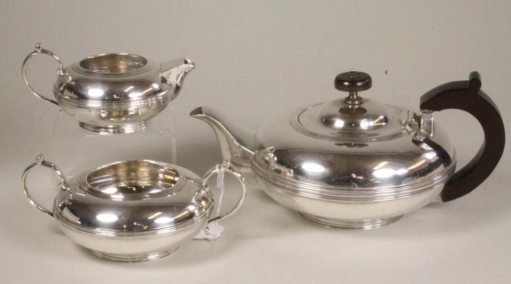 A COMPOSITE THREE PIECE SILVER TEA SERVICE Image
