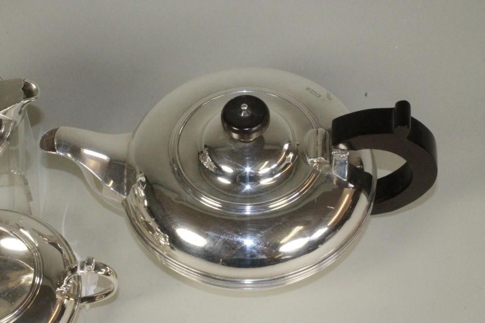 A COMPOSITE THREE PIECE SILVER TEA SERVICE Image